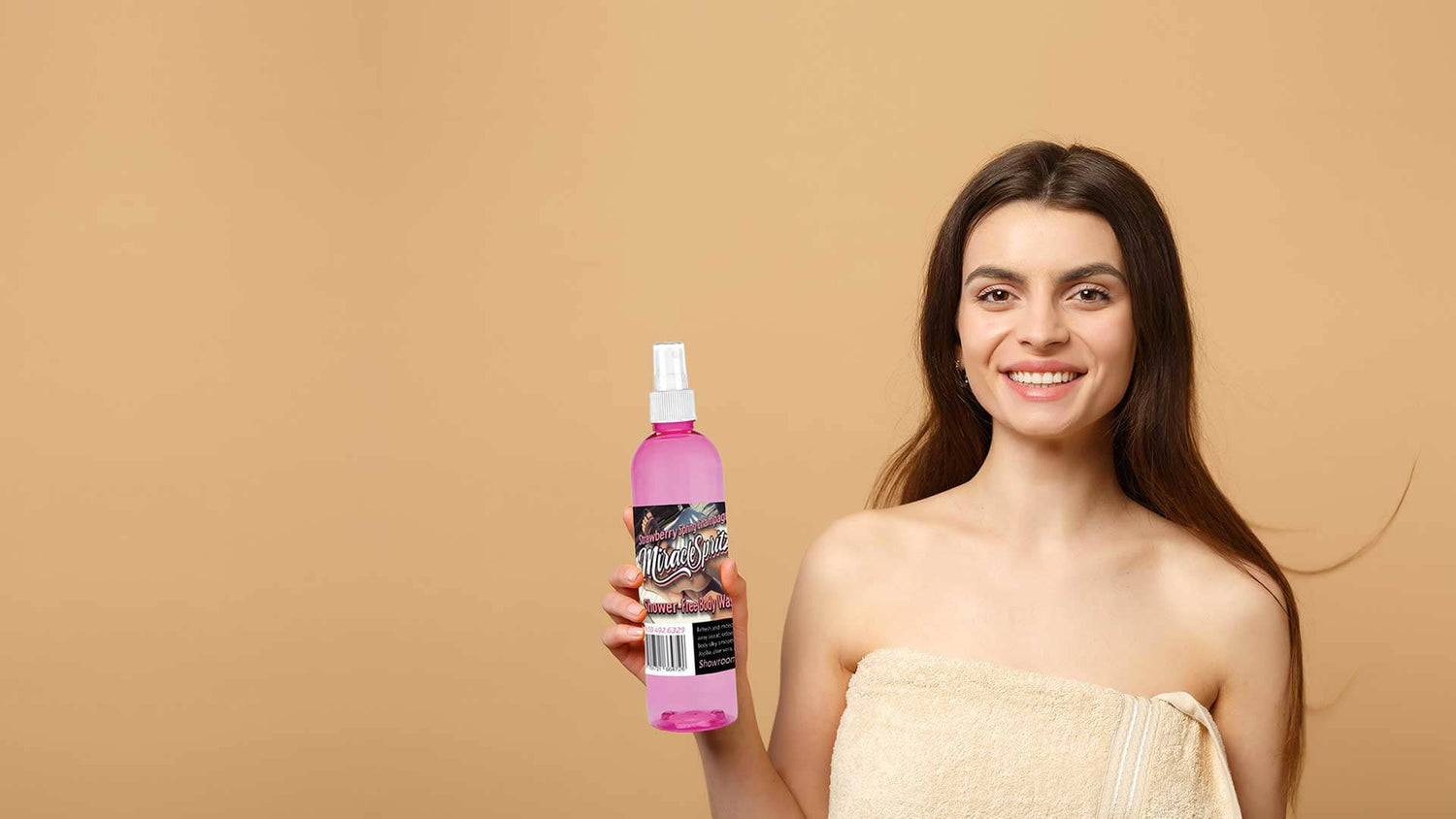 a female model, is holding a bottle of Miracle Spritz